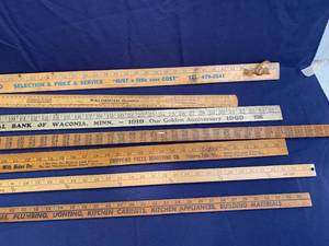 lot 68 image: R Seven Vintage Yard Sticks, One Quart Liquid Oil Can