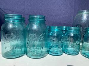 lot 101 image: Blue-green Ball Jars and Glass Transformers