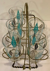 lot 92 image: Set of Five Mid Century Tumblers with Atomic Leaf Design and Caddy