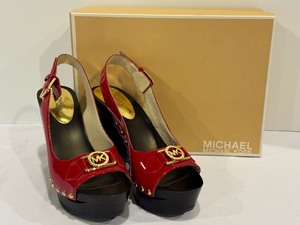 lot 298 image: Michael Kors Red Charm Slings
