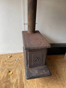 lot 348 image: Rusty Metal Wood Burning Stove