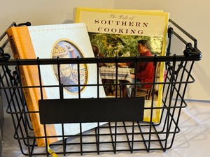 lot 483 image: Two Decorative Black Metal Baskets and Variety of Fun Cookbooks