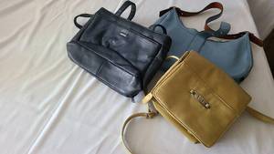 Three leather or pleather handbags....