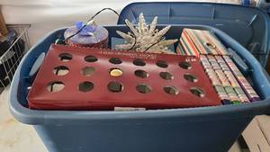 Tote of christmas decorations and c...