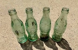 lot 40 image: (4) Vintage Coke Bottles - All Marked With City Plant Names