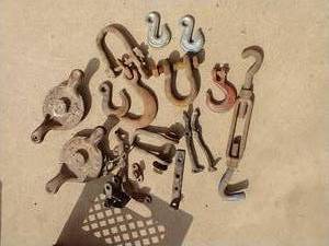 lot 110 image: Crate of Cast Iron Hooks & Parts