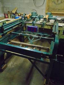 lot 110 image: Kurt 3 head carving machine with table. Needs to be disassembled to remove. Bring tools & help. Plugs are # 111. As shown.