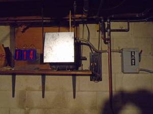 lot 114 image: 3 phase rotary converter. Needs to be taken off wall. Approx 6 high. Will be disconnected from power. As shown.