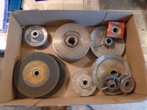 lot 122 image: Flat of pulleys & grinding wheels. As shown.