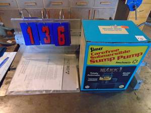 lot 136 image: Simer sump pump. Used condition. Been sitting awhile. As shown.