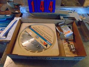 lot 144 image: Flat with saw bladesdrill chuk & stapler. As shown.