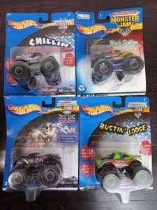 lot 13 image: Four Packs Of Monster Jam Hot Wheels