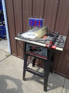 10 table saw. Aluminum bed with stand, fence & miter. Ready to work. As shown.