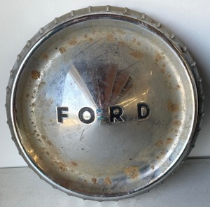 lot 68 image: Three Vintage Dodge and Ford Hubcaps