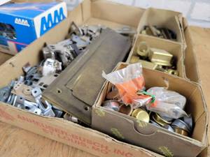 lot 153 image: Garage Door Hardware, Roofing Nails, Hinges, Brass Mail Slots and More