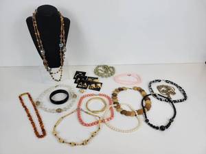 lot 716 image: Lot of Necklaces, Bangle Bracelets, Earrings, and Cocktail Ring