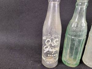 lot 886 image: (5) Vintage Bottles - O-So Grape, Jacob Ries Shakopee, MN - Daltons Quality Beverages Sioux Falls, SD - Coca-Cola Wichita Falls, TX - CAL Cola (Bent)