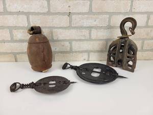 lot 615 image: Antique Cow Bell, Cast Iron Pulley and (2) Cast Iron Stove Dampers
