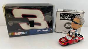 lot 275 image: 2002 ( Arbys ) Coca-Cola  Bobble Head Nodder NASCAR # 28 Ricky Rudd In Original Box And Dale Earnhardt NASCAR Seat Cover