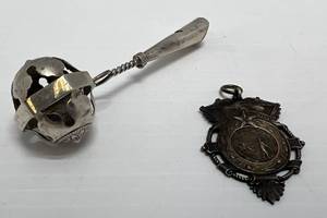 lot 172 image: 14th Natl. W. R. C. ( Womens Rights Convention ) St. Paul Minn. Sept. 1896 Pendant & Vintage Baby Rattle ( Possible Sterling Silver Plated )