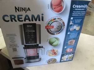lot 99 image: Ninja CREAMi 7-in-1 Ice Cream Maker...