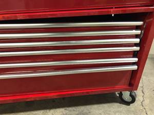 lot 33 image: Husky 61 in. W x 22.1 in D Standard Duty 7-Drawer 1-Door Mobile Workbench Tool Chest with Solid Wood Top in Gloss Red  Customer Returns See Pictures