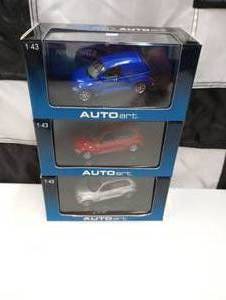 lot 5 image: (3) Autoart 143 Scale Die Cast Cars Pannel, GT & PT Cruiser
