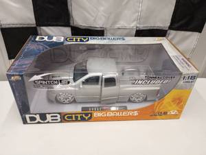 lot 27 image: Dub City Big Ballers 118 Scale Die Cast Dodge Ram Silver Truck