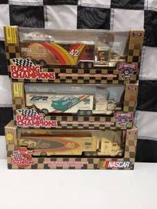 lot 72 image: Racing Champions 164 Scale Gold Die Cast  Transporter With Stock Car