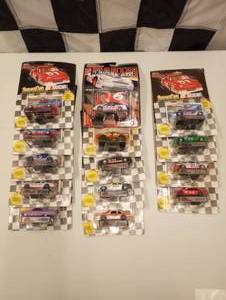 lot 76 image: Racing Champions 164 Scale Die Cast Cars With Collectors Card and Display Stand