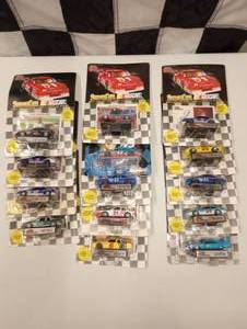 lot 74 image: Racing Champions 164 Scale Die Cast Cars With Collectors Card and Display Stand