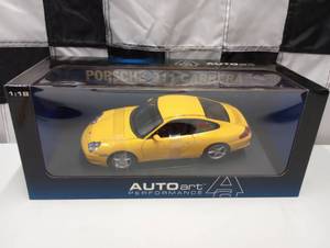 lot 99 image: Autoart Performance 118 Scale Yellow Porsche 911 Carrera Die Cast Car