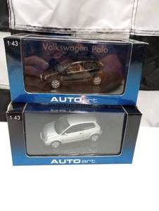 lot 131 image: Two Autoart 143  Scale Volkswagon Polo Die Cast Cars