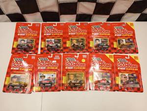 lot 412 image: Racing Champions 50th Anniversary 164th Scale Die Cast Car, Stand, and Collector Card