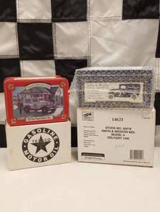 lot 558 image: Texaco & Smith And Wesson Tins With 164th Scale Die Cast Cars