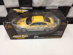 lot 573 image: Ertl Collectible American Muscle 2004 Pontiac GTO Street Machine 118th Scale Die Cast Car