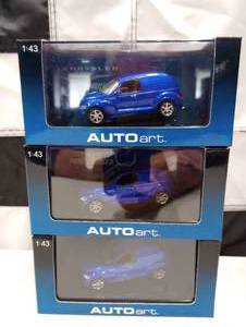 lot 576 image: (3) Autoart 43rd Scale Panel Cruiser Die Cast Cars