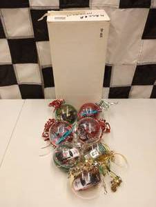 lot 657 image: Assorted Nascar Christmas  Bulb Ornaments With 164th Scale Die Cast Cars Inside