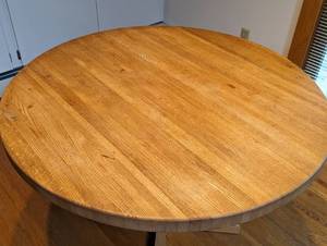 lot 9 image: Round Blonde Wood Dining Table