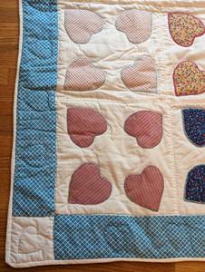 lot 44 image: Colorful Hearts Baby Quilt