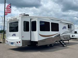 lot 1 image: 2012 Forest River Cedar Creek 36RE Triple Slide 5th Wheel NO RESERVE