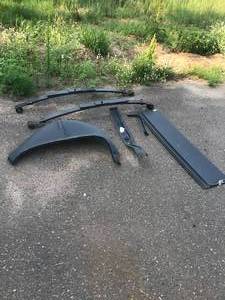 lot 13 image: Huge Parts lot Includes - 1967-69 Camaro Hotchkis drop spring, 1967-69 Camaro trunk filler panel, 1968-72 Chevelle trunk floor brace, 1964-65 Chevelle RH wheelhouse