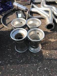 lot 16 image: Huge Parts lot Includes - Camaro upper control arms -rebuilt, Go-cart Rims tires and Misc Parts, Billet Air cleaner, headers, Pontiac hood hinges, 1968-72 Chevell 1968-70 Charger New Valance AC condenser universal