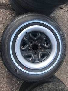 lot 57 image: 2 Oldsmobile Rims with Like New Tires