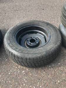 lot 69 image: 5 x 4.5 Rim with Like New Goodyear Tire