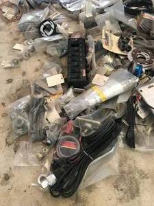 lot 77 image: Huge Parts Lot - Includes the following  Much More - Dakota Digital wiring accessories, race dash , breathers, steering hubs, Lokar dipstick, Fan switches, misc. Trim