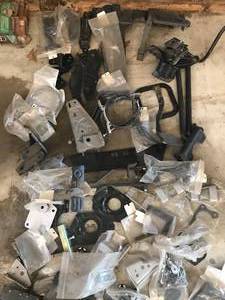 lot 80 image: Huge Parts Lot - Includes the following  Much More - Gm Hood Release, brake pedal, wiper brackets Chevelle, brake boosted brackets, Misc. ebrakes, core support brackets