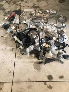 lot 92 image: Huge lot of Parts - Includes  More - Alternator Brackets, P.S. Brackets Tons of body seals Camaro Chevelle, P.S. reservoir, Seatbelts MOSTLY ALL NEW