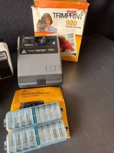 lot 57 image: Lot of Vintage Kodak Instant Cameras Trimprint, Instamatic Movie Outfit & More