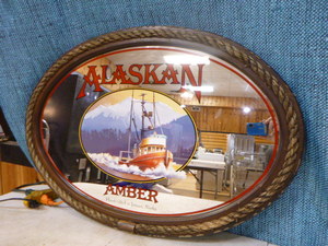 lot 9 image: Alaskan Amber Oval Mirror Sign